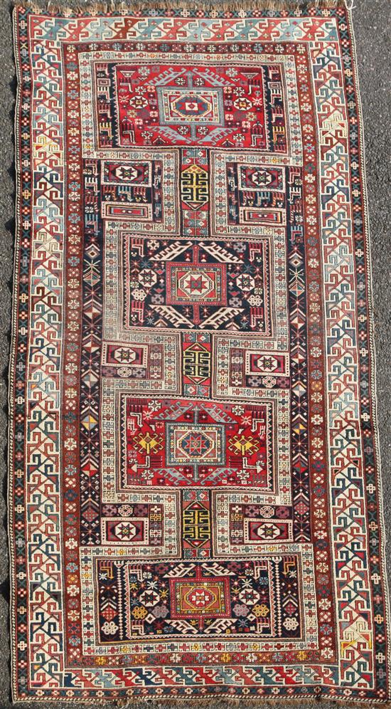 A Shirvan multi coloured rug, c.1900, 8ft 10in by 3ft 11in.